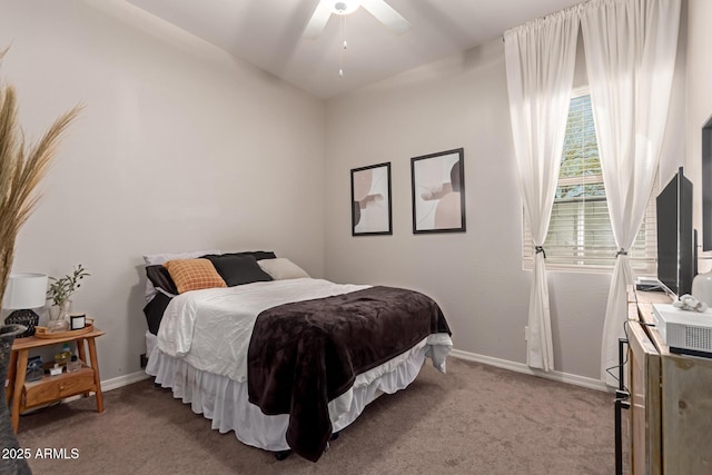 bedroom with ceiling fan, baseboards, and carpet floors