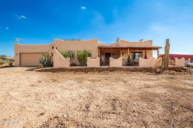 southwest-style home with a garage