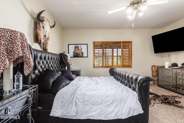 carpeted bedroom with ceiling fan