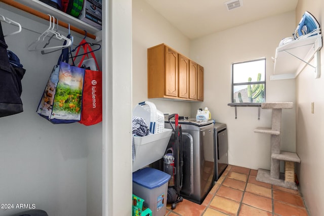 laundry room featuring cabinets and independent washer and dryer