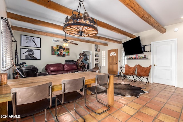 dining area with beam ceiling and ceiling fan