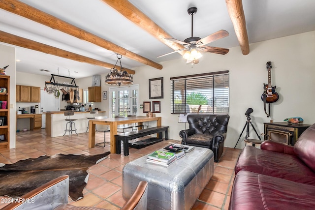 living room with light tile patterned floors, beam ceiling, and ceiling fan