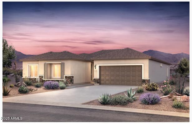 view of front facade featuring a mountain view and a garage