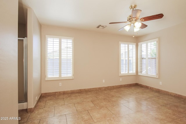 3750 S Conestoga Rd, Apache Junction, AZ 85119 - empty room with a ceiling fan and light tile patterned floors