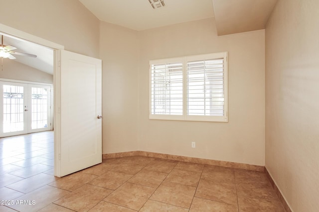 3750 S Conestoga Rd, Apache Junction, AZ 85119 - spare room featuring french doors, ceiling fan, light tile patterned floors, and lofted ceiling