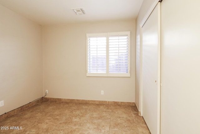 3750 S Conestoga Rd, Apache Junction, AZ 85119 - unfurnished bedroom featuring a closet and baseboards