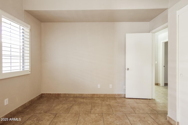 3750 S Conestoga Rd, Apache Junction, AZ 85119 - empty room with baseboards and light tile patterned floors