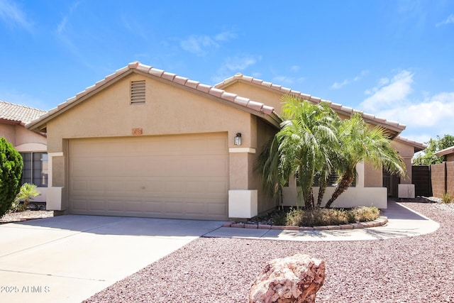 3750 S Conestoga Rd, Apache Junction, AZ 85119 - view of front of house with stucco siding, an attached garage, driveway, and a tiled roof