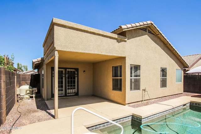 3750 S Conestoga Rd, Apache Junction, AZ 85119 - rear view of house with stucco siding, a fenced backyard, a patio area, and a tile roof