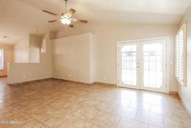 3750 S Conestoga Rd, Apache Junction, AZ 85119 - spare room with vaulted ceiling, a ceiling fan, light tile patterned flooring, and french doors