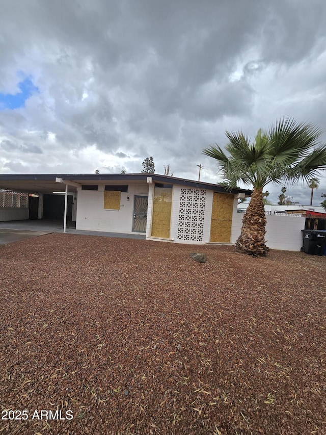 exterior space featuring an attached carport