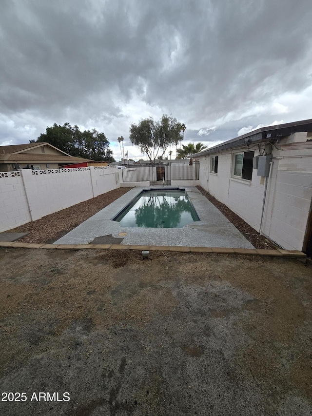 view of pool with a fenced backyard, a fenced in pool, and a patio