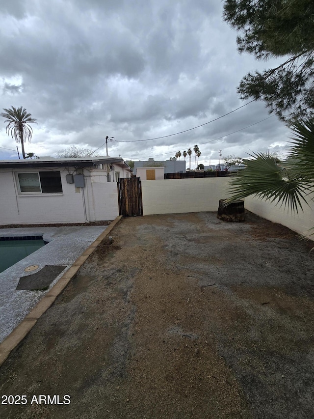 view of yard with a gate and fence