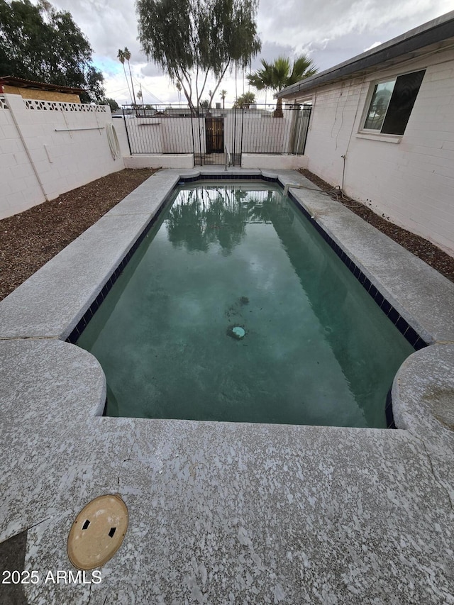 view of pool with a fenced backyard and a fenced in pool