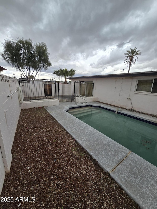 view of pool featuring a fenced backyard and a fenced in pool