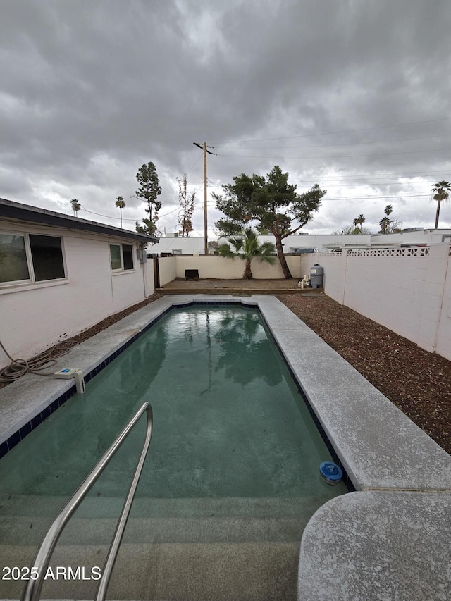 view of swimming pool featuring a fenced in pool and a fenced backyard