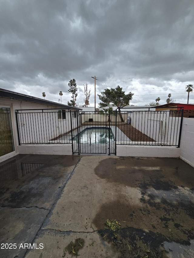 view of gate featuring fence