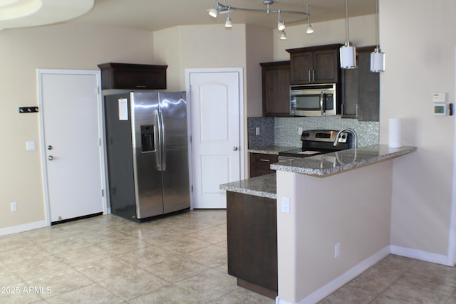 kitchen featuring light stone countertops, pendant lighting, stainless steel appliances, decorative backsplash, and dark brown cabinets