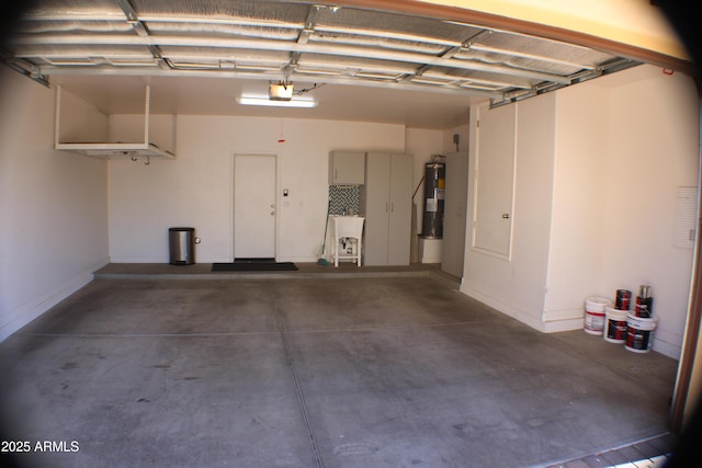 garage featuring water heater and a garage door opener