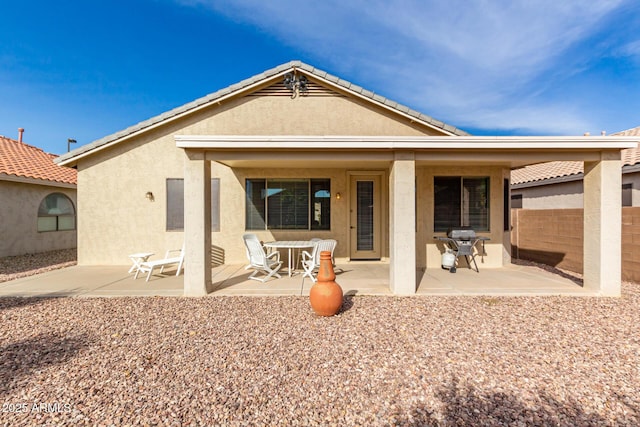 back of property featuring a patio