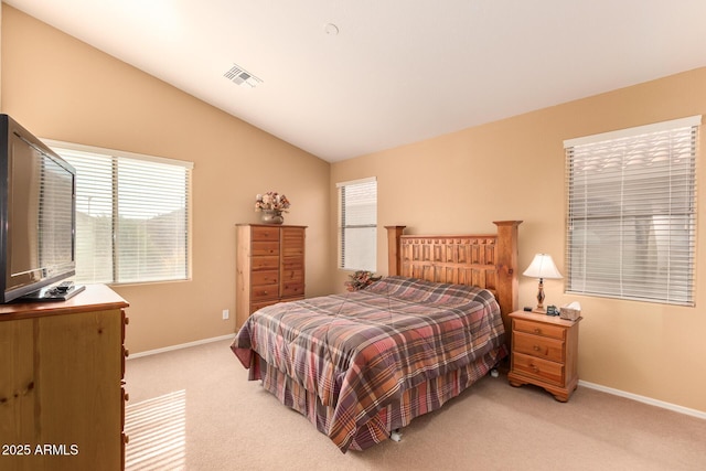 bedroom with light carpet and vaulted ceiling