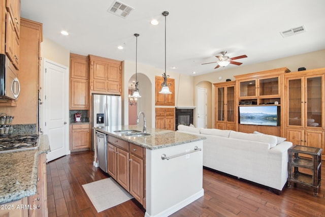 9305 E Canyon View Rd, Scottsdale, AZ 85255 - kitchen with a sink, arched walkways, visible vents, and stainless steel appliances