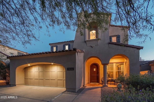 9305 E Canyon View Rd, Scottsdale, AZ 85255 - mediterranean / spanish house with a tile roof, concrete driveway, a garage, and stucco siding