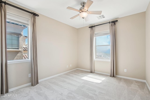 9305 E Canyon View Rd, Scottsdale, AZ 85255 - carpeted empty room with visible vents, baseboards, and ceiling fan
