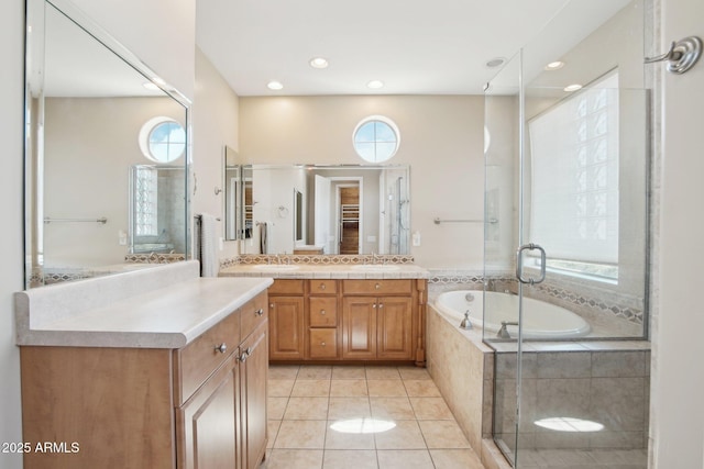 9305 E Canyon View Rd, Scottsdale, AZ 85255 - full bathroom with vanity, recessed lighting, a stall shower, tile patterned flooring, and a garden tub