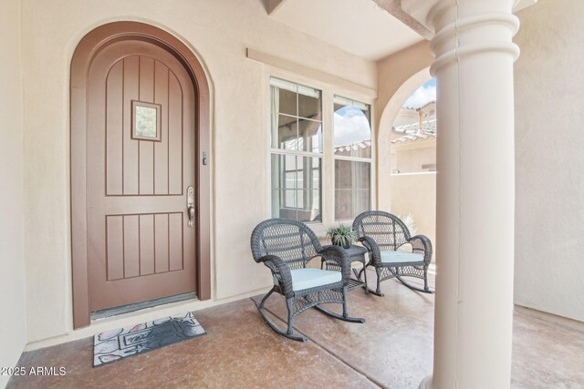 9305 E Canyon View Rd, Scottsdale, AZ 85255 - doorway to property with stucco siding and a porch