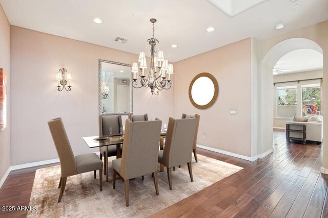 9305 E Canyon View Rd, Scottsdale, AZ 85255 - dining area featuring recessed lighting, wood finished floors, arched walkways, and baseboards