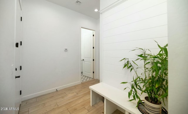 mudroom with recessed lighting, light wood-type flooring, baseboards, and visible vents