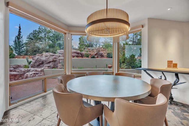 dining area featuring stone tile flooring