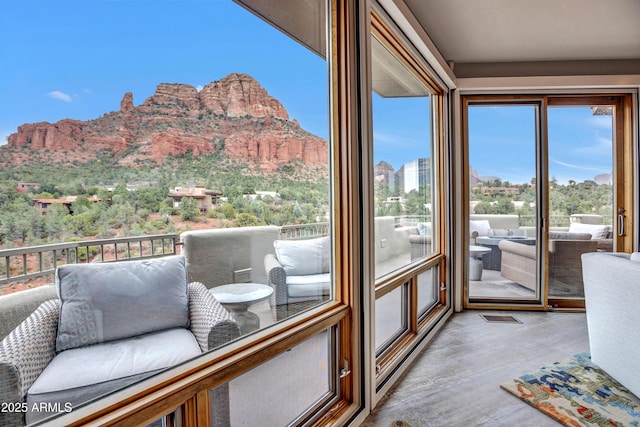 sunroom / solarium with a mountain view