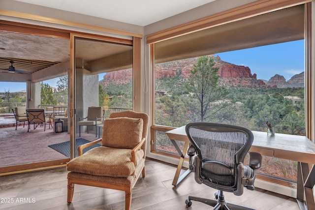 sunroom / solarium with a mountain view