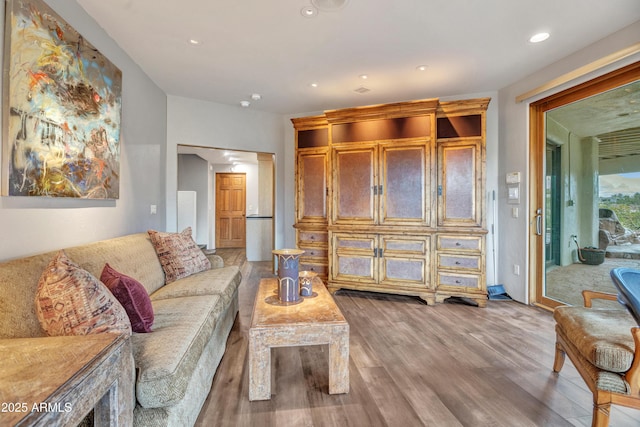 living room featuring recessed lighting and wood finished floors