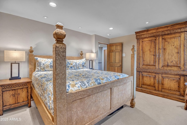 bedroom with light carpet and recessed lighting
