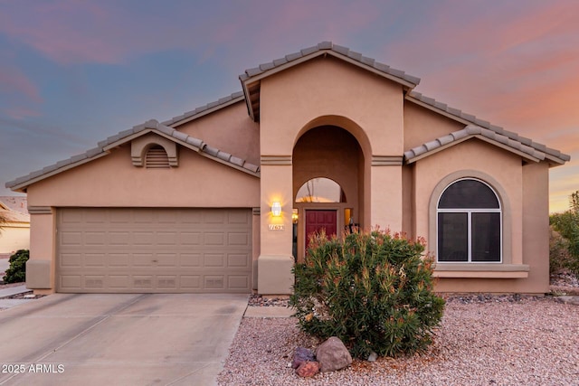 view of front of home with a garage