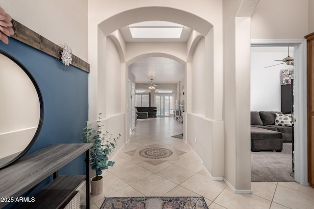 hall featuring light tile patterned flooring