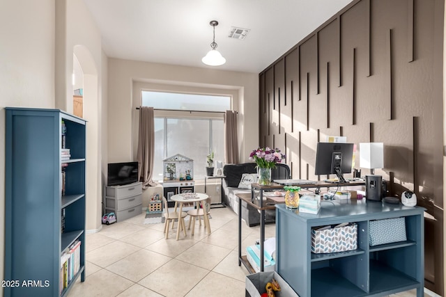 kitchen featuring light tile patterned floors and decorative light fixtures