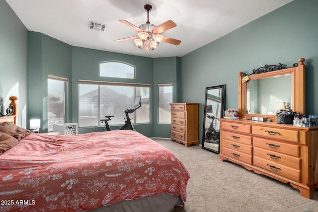 bedroom with light carpet and ceiling fan