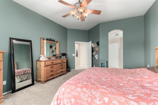 bedroom featuring light colored carpet and ceiling fan