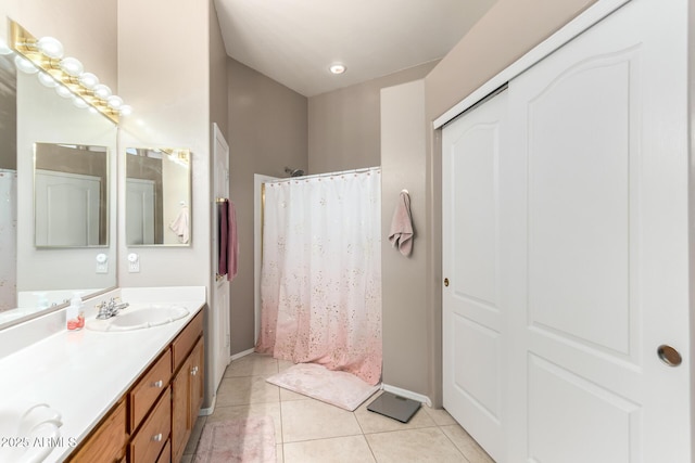 bathroom featuring tile patterned flooring and vanity