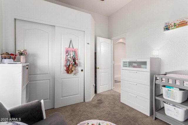 carpeted bedroom with a closet