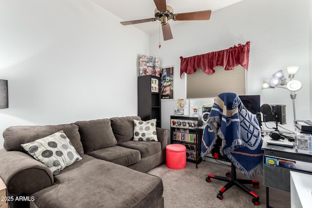 carpeted home office featuring vaulted ceiling and ceiling fan