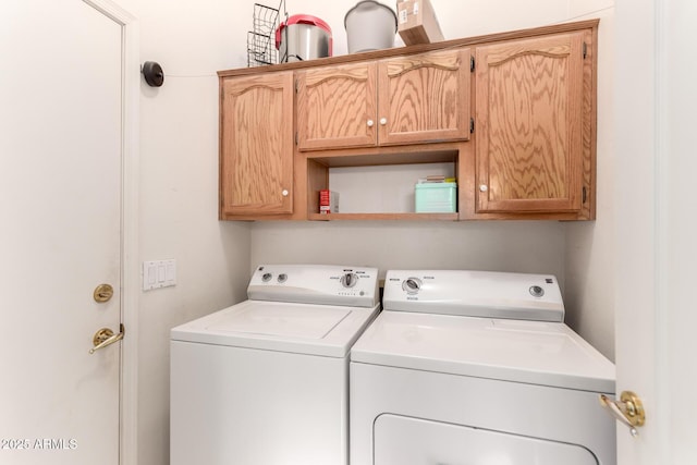 laundry area featuring cabinets and independent washer and dryer