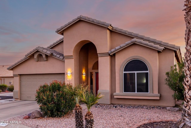 view of front of property with a garage