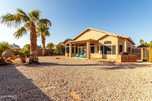 back of property with a patio