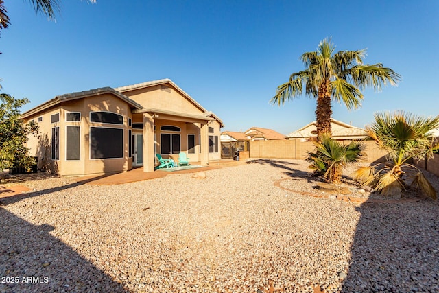 rear view of property with a patio