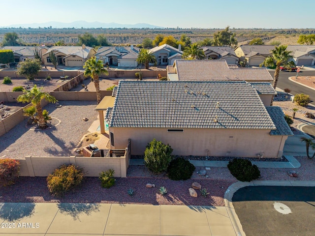 birds eye view of property with a mountain view